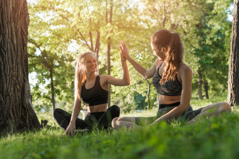 young-women-doing-yoga-park